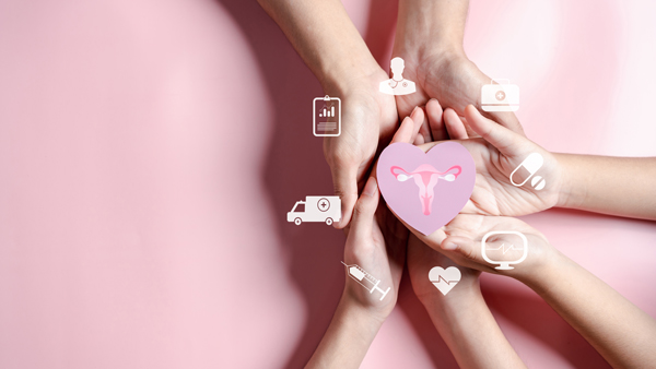 Hands of different ethnicities holding a pink heart with a uterus symbol, surrounded by health-related icons, representing women's health awareness.